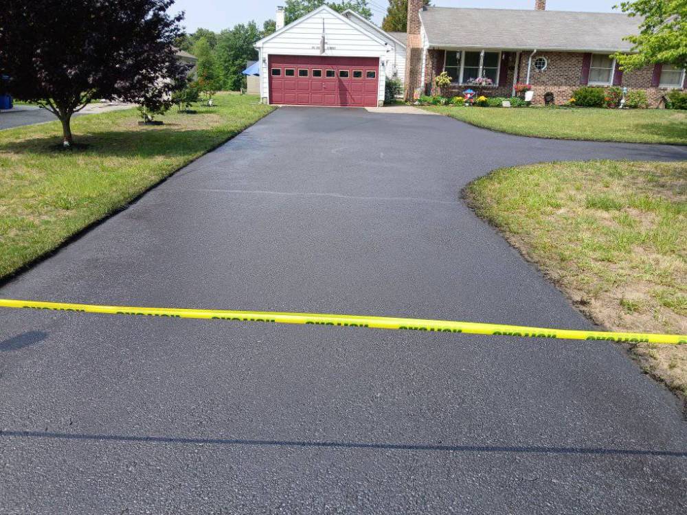 Driveway Sealcoating 101: Reasons, Method, and Timing